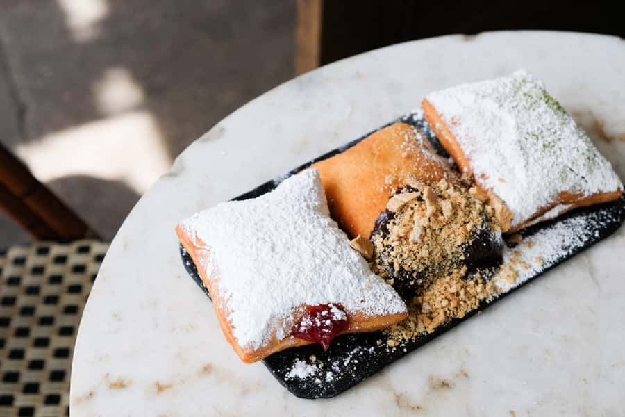 New Orleans: Guided Delicious Beignet Tour with Tastings - Magazine Street strolling: boutiques, cafés, and the smell of coffee