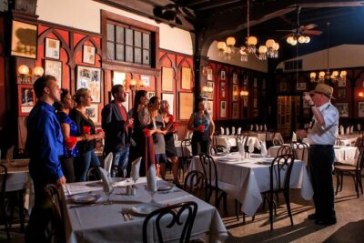 New Orleans Original Craft Cocktail Walking Tour - Stop 2 at Court of Two Sisters: the courtyard vibe and the Carriageway Bar
